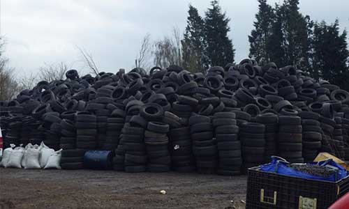 Abandoned tire stockpile poses threat to residential community in the UK