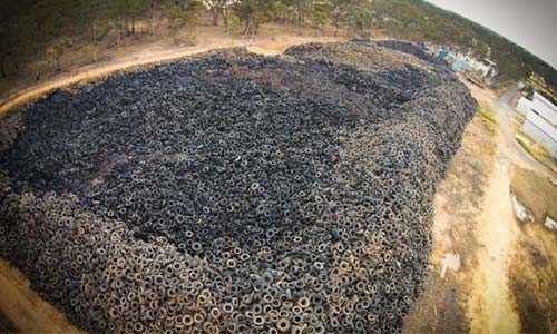 Stand-off over fees between nine million tire pile owners and Australian Government