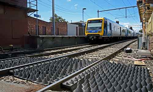 British anti-trespass panels made of recycled tire rubber deployed on Australian railroads